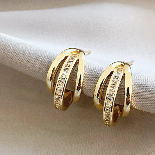 Trójkowe kolczyki z opon w złocie